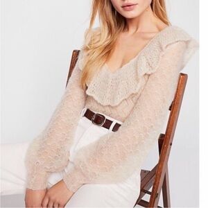 Free People Mohair Macaroon V-neck sweater featuring ruffle neck. Size XS.